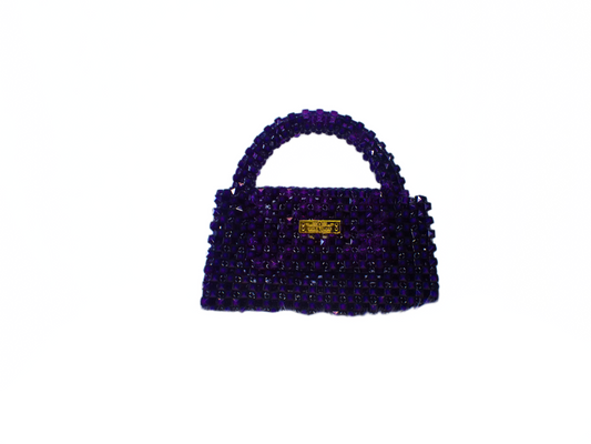Purple handbag with a gold clasp on a white background