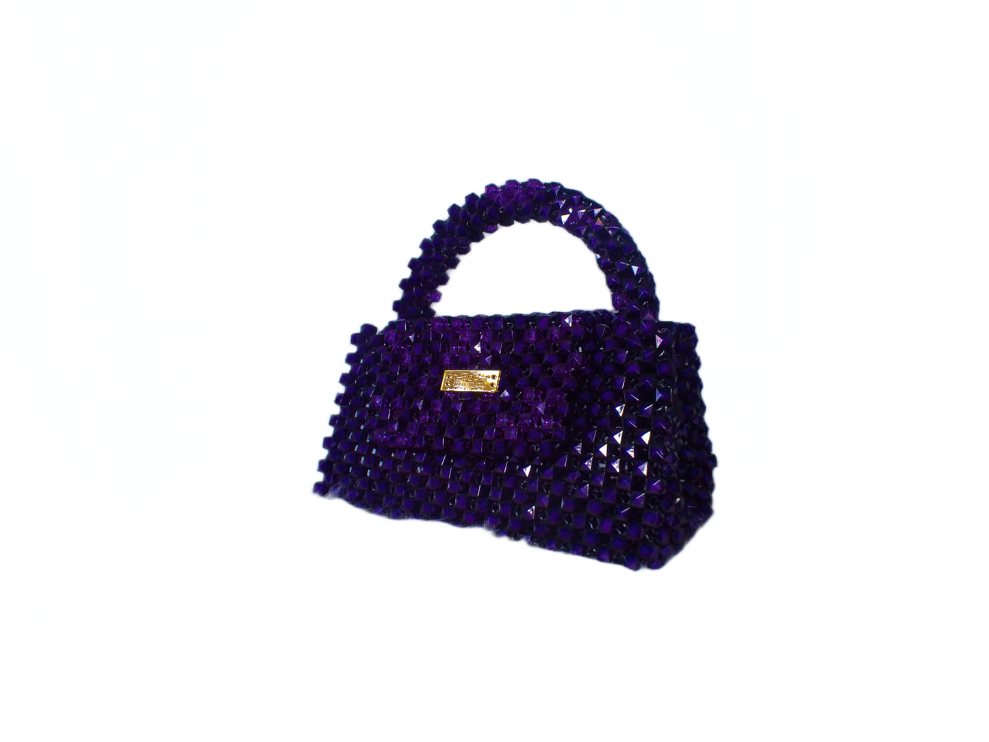 Purple beaded handbag with a gold clasp on a white background